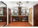 Elegant bathroom with dual vanities, large mirror, and tile flooring at 6617 N Central Ave, Phoenix, AZ 85012