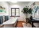 Bathroom with a large soaking tub and a separate vanity area at 6617 N Central Ave, Phoenix, AZ 85012
