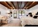 Bedroom with two twin beds and access to the backyard at 6617 N Central Ave, Phoenix, AZ 85012