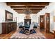 Elegant dining room with large chandelier, ornate cabinetry, and rich wood floors at 6617 N Central Ave, Phoenix, AZ 85012