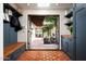 Mudroom with built-in bench, cabinets, and access to the backyard at 6617 N Central Ave, Phoenix, AZ 85012