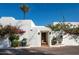 Elegant entryway with ornate wooden doors and vibrant bougainvillea at 6617 N Central Ave, Phoenix, AZ 85012