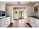 Bright and airy kitchen features French doors leading to an outdoor patio at 6617 N Central Ave, Phoenix, AZ 85012
