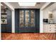 Butler's pantry with dark blue cabinetry and ample storage for china and glassware at 6617 N Central Ave, Phoenix, AZ 85012