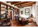 Spacious library featuring a wood burning fireplace and extensive built-in shelving at 6617 N Central Ave, Phoenix, AZ 85012