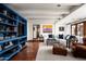 Spacious living room with built-in shelving, comfortable seating, and terracotta floors at 6617 N Central Ave, Phoenix, AZ 85012
