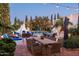 Outdoor patio with dining area, fireplace, and string lights at 6617 N Central Ave, Phoenix, AZ 85012