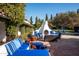 Relaxing patio with blue couches and a fire pit at 6617 N Central Ave, Phoenix, AZ 85012