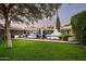 Expansive pool area with lush landscaping and walkways at 6617 N Central Ave, Phoenix, AZ 85012