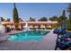Inviting swimming pool with lounge chairs and string lights at 6617 N Central Ave, Phoenix, AZ 85012