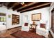Charming sitting room with tiled floors, comfortable chairs, and built-in shelving at 6617 N Central Ave, Phoenix, AZ 85012