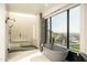 Spa-like bathroom with a walk-in shower and freestanding tub at 7147 N 23Rd Pl, Phoenix, AZ 85020