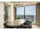 Modern dining area with city views and adjacent wine storage at 7147 N 23Rd Pl, Phoenix, AZ 85020