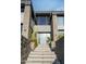 Contemporary home's entrance with stone steps and cactus plants at 7147 N 23Rd Pl, Phoenix, AZ 85020