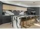 Contemporary kitchen with marble countertops and gold barstools at 7147 N 23Rd Pl, Phoenix, AZ 85020