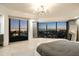 Main bedroom with panoramic nighttime city views at 7147 N 23Rd Pl, Phoenix, AZ 85020
