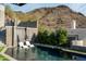 Inviting pool with waterfall feature and comfortable lounge chairs at 7147 N 23Rd Pl, Phoenix, AZ 85020