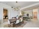 Open concept dining area with a view into the modern kitchen at 7180 E Kierland Blvd # 1209, Scottsdale, AZ 85254