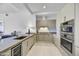 Contemporary kitchen featuring stainless steel appliances and sleek cabinetry at 7180 E Kierland Blvd # 1209, Scottsdale, AZ 85254