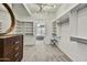 Bright walk-in closet with built-in shelving and dresser at 7180 E Kierland Blvd # 1209, Scottsdale, AZ 85254