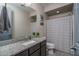Bathroom with single vanity, granite countertop, and shower/tub at 7332 W Quail Track Dr, Peoria, AZ 85383