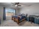 Comfortable bedroom with a queen-size bed and built-in desk at 7332 W Quail Track Dr, Peoria, AZ 85383