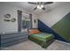 Bedroom with twin bed, dresser, and geometric accent wall at 7332 W Quail Track Dr, Peoria, AZ 85383