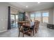 Bright dining area with sliding doors leading to the backyard at 7332 W Quail Track Dr, Peoria, AZ 85383