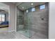 Large walk-in shower with glass enclosure and tile surround at 7332 W Quail Track Dr, Peoria, AZ 85383