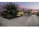 Single-story home with a paved driveway and landscaping at 8414 N 38Th Dr, Phoenix, AZ 85051