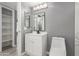 Updated bathroom with white vanity and grey walls at 8908 W Loma Ln, Peoria, AZ 85345
