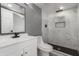 Modern bathroom with marble shower and white vanity at 8908 W Loma Ln, Peoria, AZ 85345