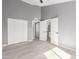 Bright bedroom with ample closet space and access to a shared bathroom at 8908 W Loma Ln, Peoria, AZ 85345