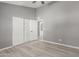 Well-lit bedroom with wood-look floors and plenty of closet space at 8908 W Loma Ln, Peoria, AZ 85345