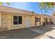 Bright yellow exterior condo with new landscaping at 8908 W Loma Ln, Peoria, AZ 85345