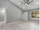 Bright living room with vaulted ceiling and new flooring at 8908 W Loma Ln, Peoria, AZ 85345