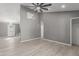 Open living area with grey walls and wood-look flooring at 8908 W Loma Ln, Peoria, AZ 85345