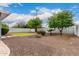 Landscaped backyard with gravel, small lawn, and desert plants at 8938 N 15Th Ln, Phoenix, AZ 85021
