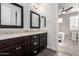 Bathroom with double vanity, granite countertops and dark brown cabinets at 8938 N 15Th Ln, Phoenix, AZ 85021