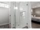 Modern bathroom with a glass shower, tile surround, and built-in shelving at 8938 N 15Th Ln, Phoenix, AZ 85021