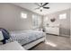 Bright bedroom with double bed, dresser, and large windows at 8938 N 15Th Ln, Phoenix, AZ 85021