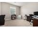 Bright home office features built-in shelving, window, and comfortable seating at 8938 N 15Th Ln, Phoenix, AZ 85021