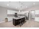 Modern kitchen with large island, stainless steel appliances, and granite countertops at 8938 N 15Th Ln, Phoenix, AZ 85021