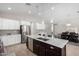 Modern kitchen with island, stainless steel appliances, and white cabinets at 8938 N 15Th Ln, Phoenix, AZ 85021