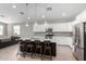 Modern kitchen with a large island, stainless steel appliances, and white cabinets at 8938 N 15Th Ln, Phoenix, AZ 85021