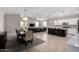 Open concept kitchen with island, stainless steel appliances, and white cabinets at 8938 N 15Th Ln, Phoenix, AZ 85021
