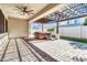 Covered patio with hot tub and pergola at 10141 E Stealth Ave, Mesa, AZ 85212