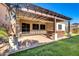 Spacious backyard with pergola, hot tub, and artificial turf at 10141 E Stealth Ave, Mesa, AZ 85212