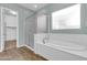 Bathroom with soaking tub and walk-in shower at 10141 E Stealth Ave, Mesa, AZ 85212