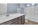 Bathroom with single vanity and shower/tub combo at 10141 E Stealth Ave, Mesa, AZ 85212